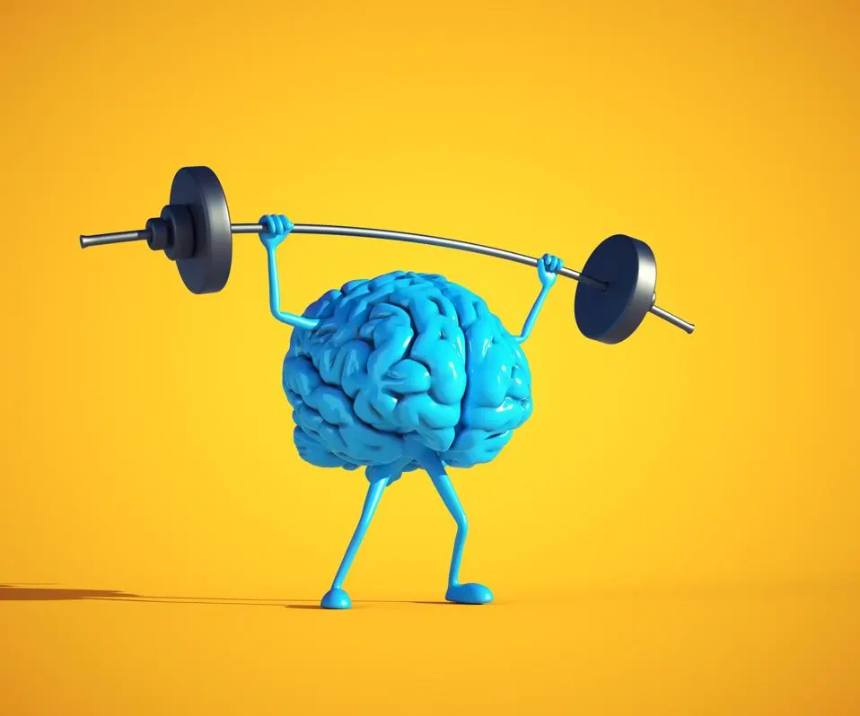 The image depicts a human brain with arms and legs lifting a barbell, symbolizing the concept of brain function as something that can be strengthened or improved