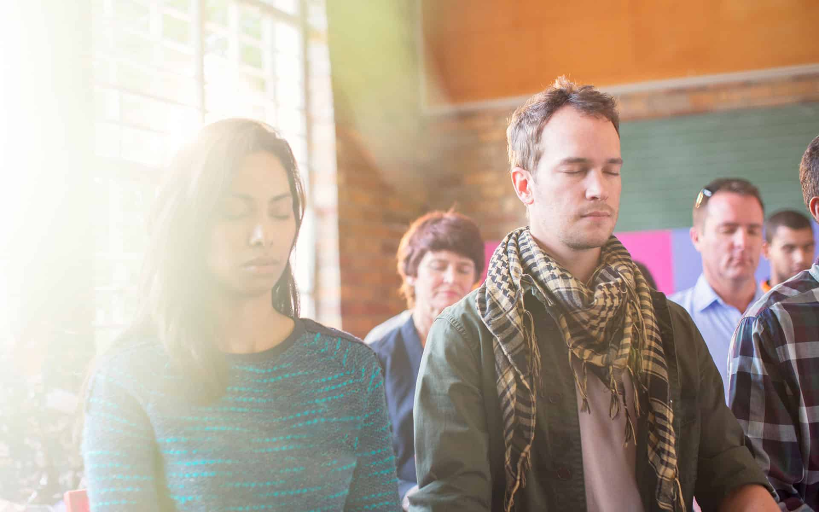 A group of people in deep meditation