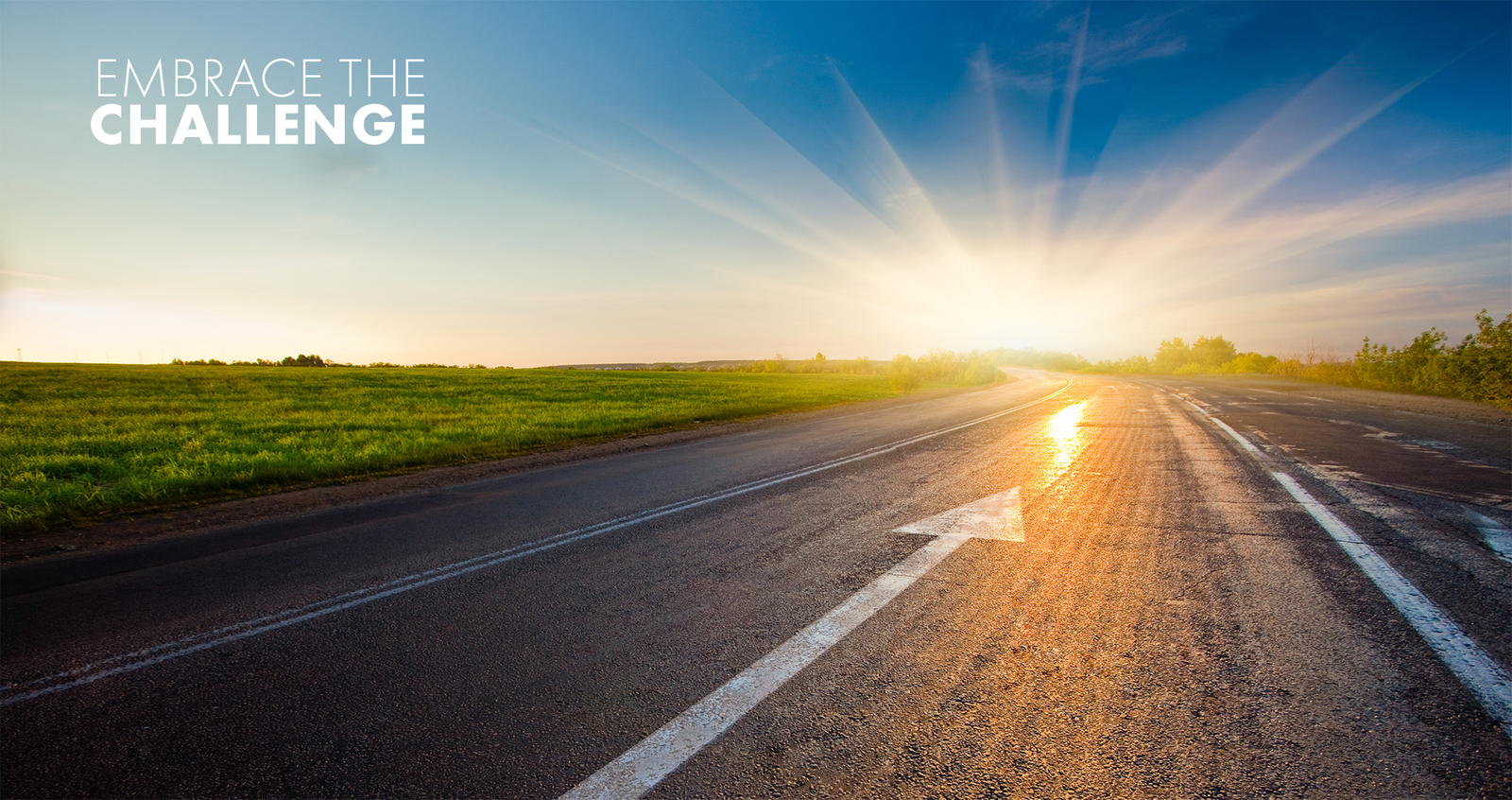 Sunset on a road with an arrow pointing forward and "EMBRACE THE CHALLENGE" text.