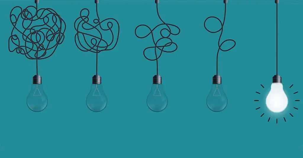 Five light bulbs on a teal background with tangled cords, one illuminated.